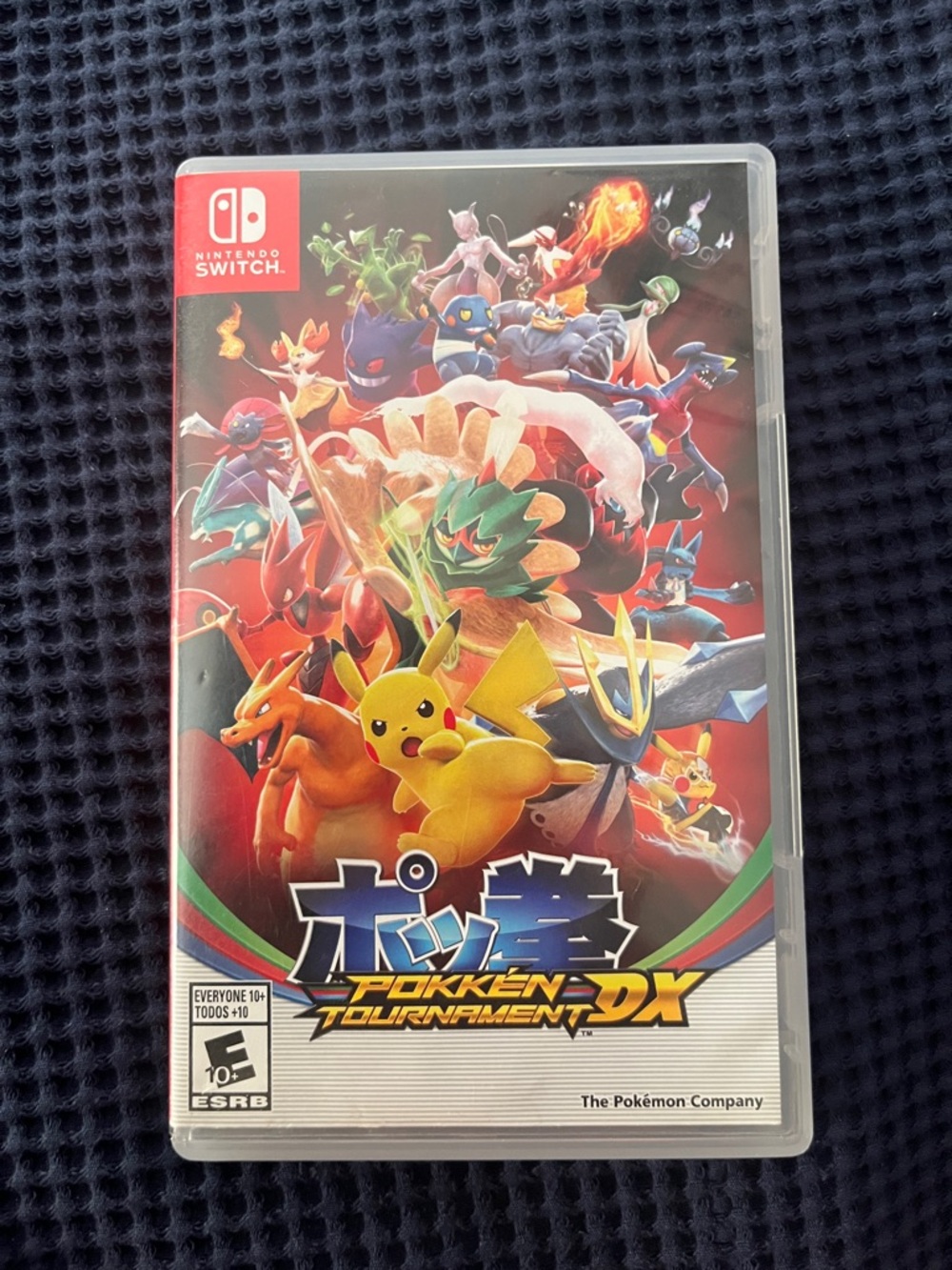 Nintendo Pokkén Tournament DX – Pokemon Fighting Red and Yellow Cover Art